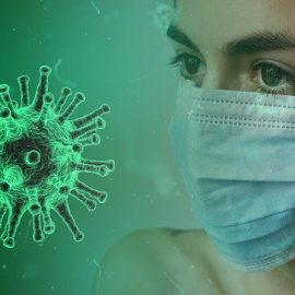 Decorative image showing woman wearing a face mask and an image of the virus