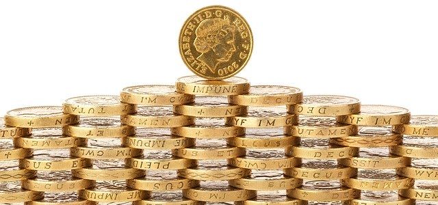 Photo of pound coins used to represent funding