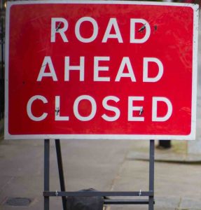 Image of "road closed ahead" sign