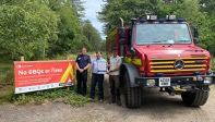 Image of fire engine and sign saying "No BBQs or fires"